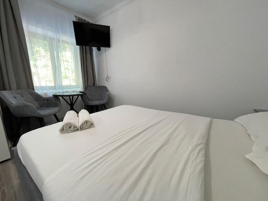 Postel nebo postele na pokoji v ubytování Green Residence Brasov