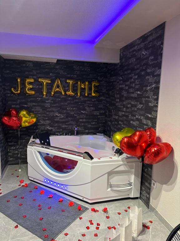 a toaster oven with a sign on a wall at T3 5 étoile jacuzzi in Toulouse