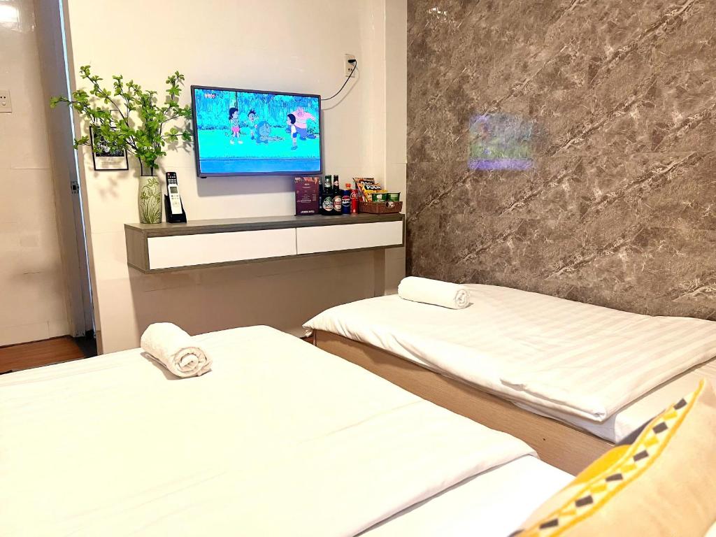 Posteľ alebo postele v izbe v ubytovaní Jasmine Hotel