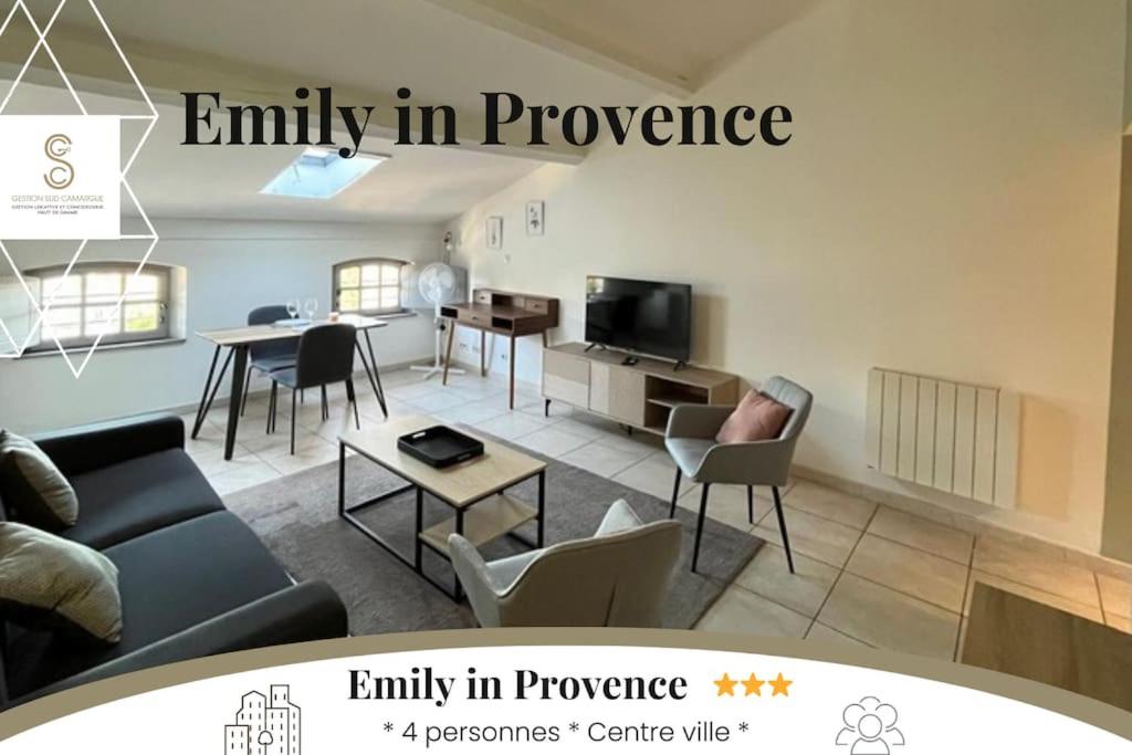 a living room with a couch and a table at Emily in Provence Arles Centre in Arles