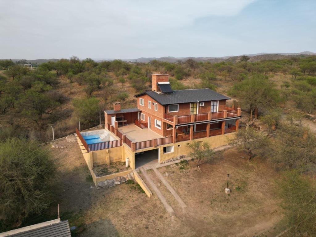 an aerial view of a house with a pool at RESIDENCIA EL TALA in Cordoba
