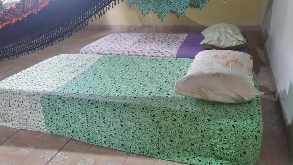 Postel nebo postele na pokoji v ubytování Quintal Hospedagem