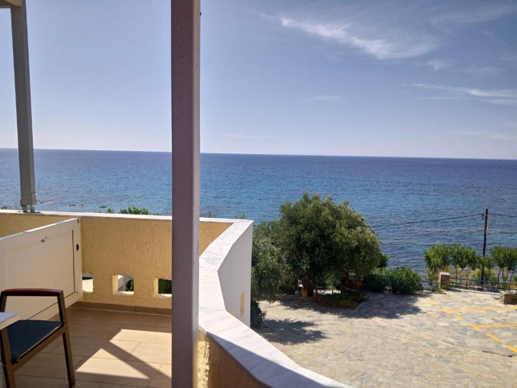 a view of the ocean from a building at Horizon Beach Hotel in Plakias
