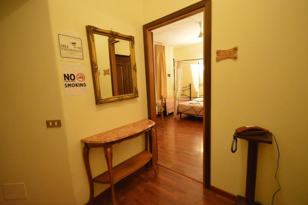 Postel nebo postele na pokoji v ubytování Hotel Alexis