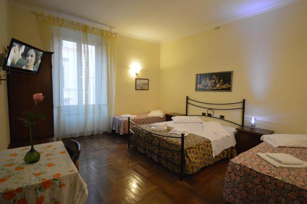 Postel nebo postele na pokoji v ubytování Hotel Alexis