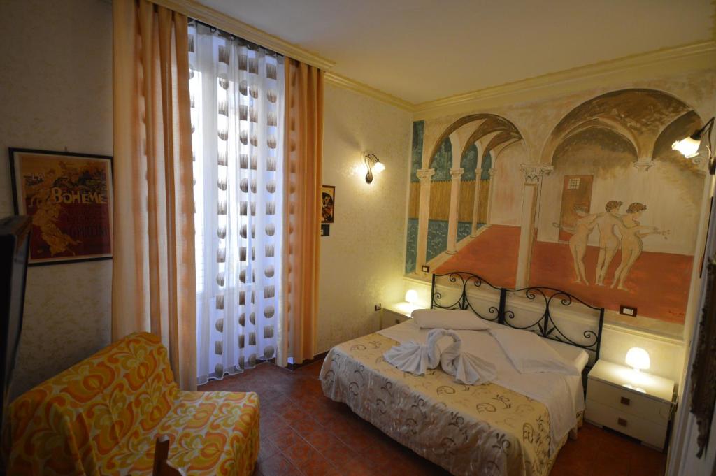 Postel nebo postele na pokoji v ubytování Hotel Alexis
