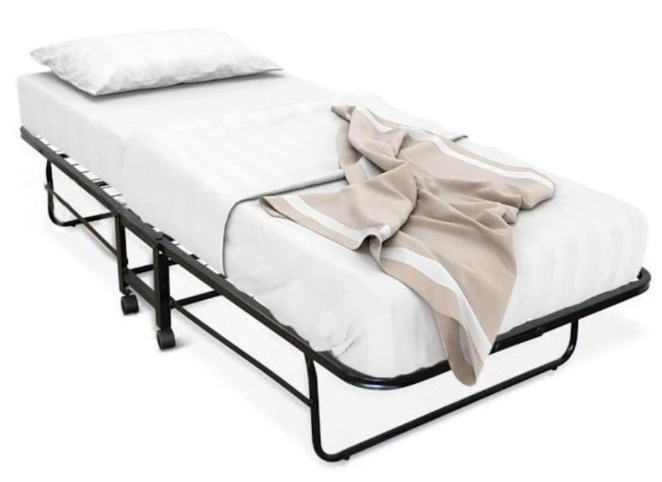 A bed or beds in a room at Xtina Studio