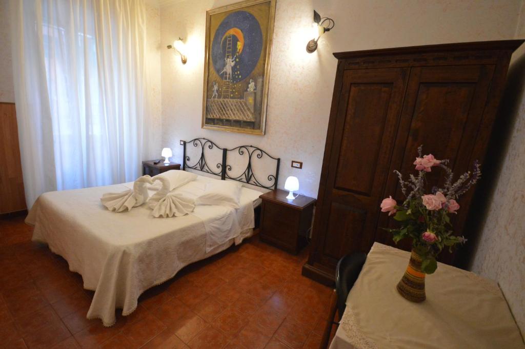 Postel nebo postele na pokoji v ubytování Hotel Alexis
