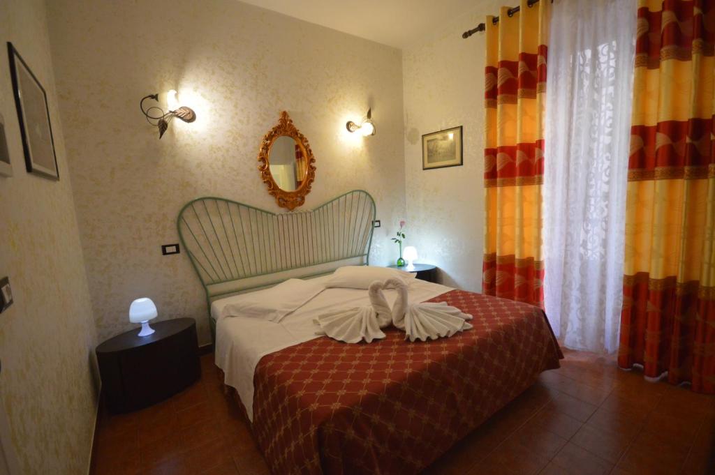 Postel nebo postele na pokoji v ubytování Hotel Alexis