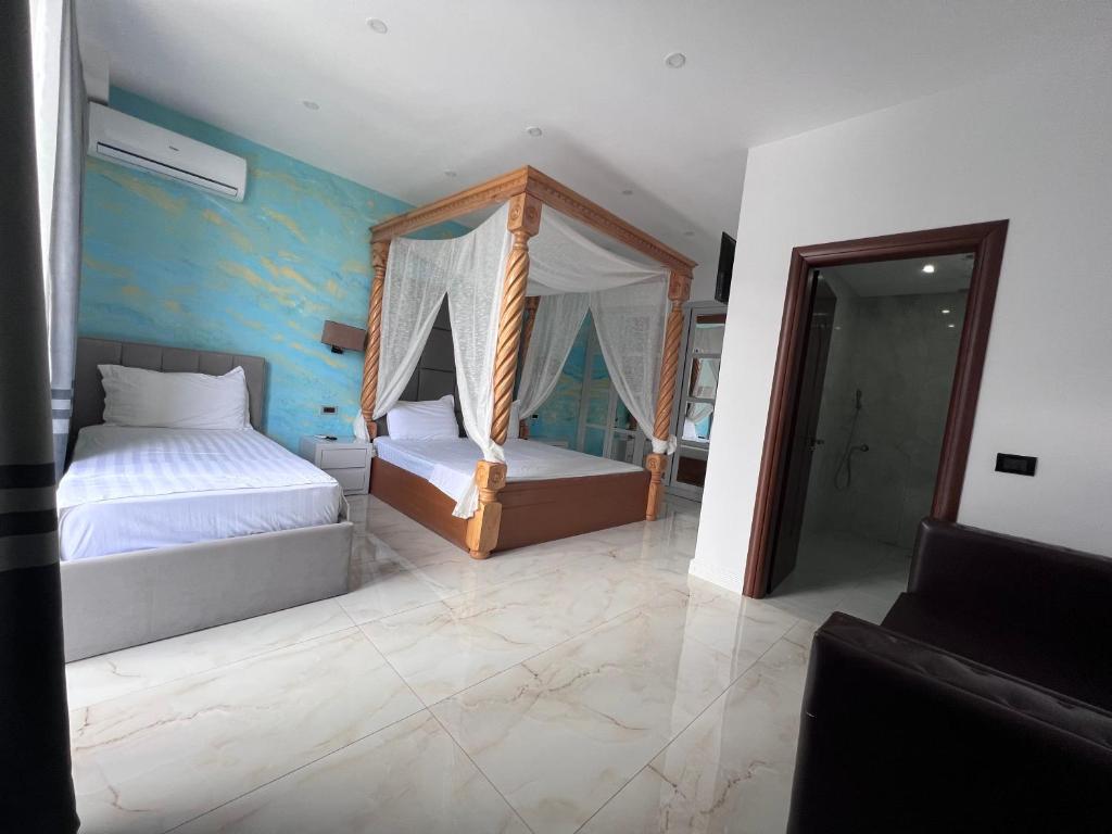 Voodi või voodid majutusasutuse Hotel Victoria toas