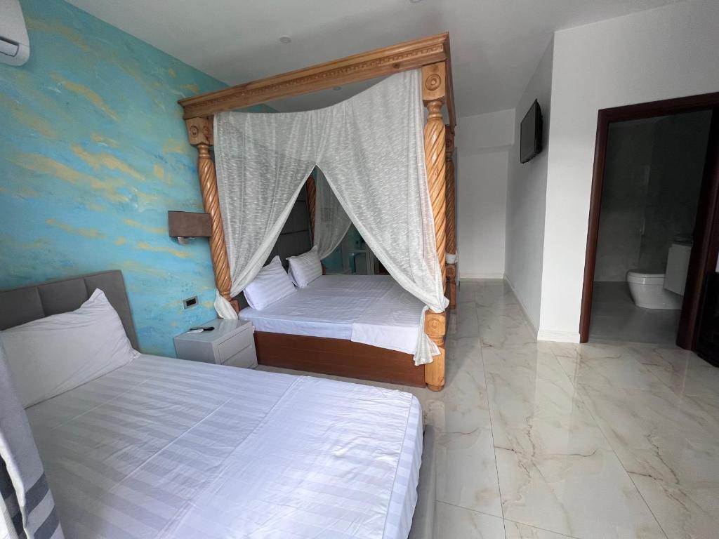 Voodi või voodid majutusasutuse Hotel Victoria toas