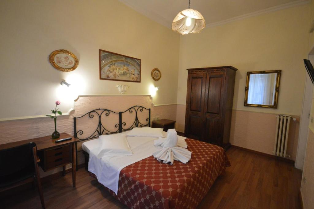 Postel nebo postele na pokoji v ubytování Hotel Alexis