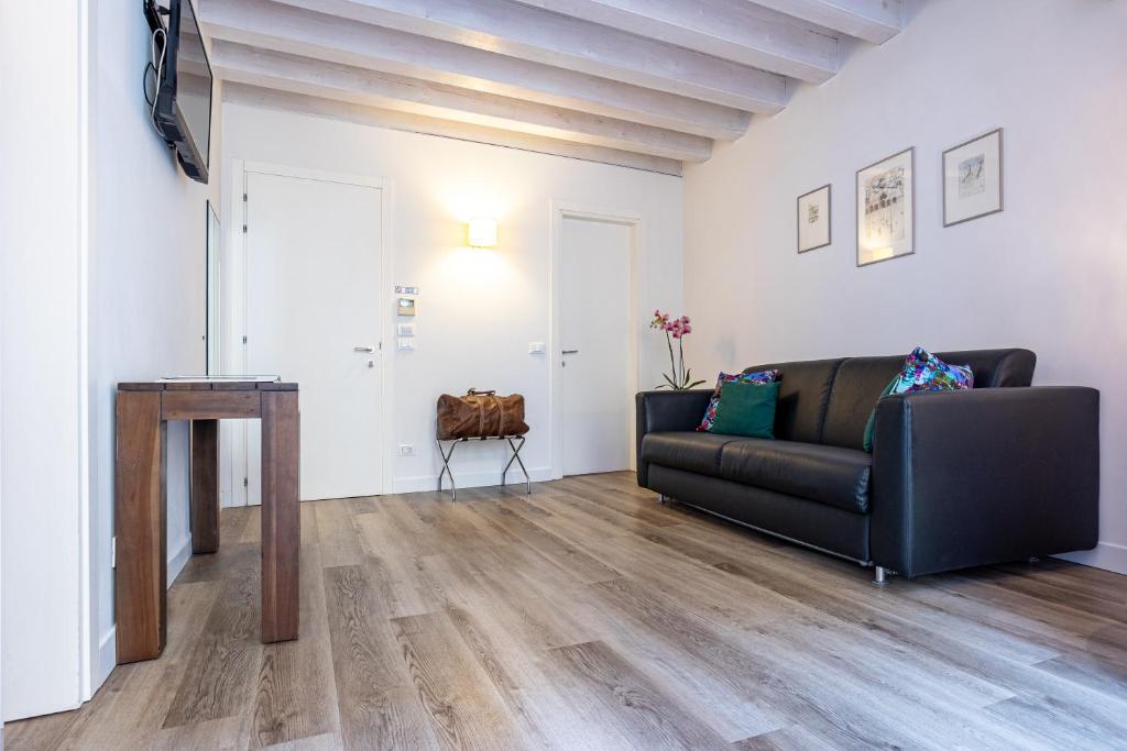 TV a/nebo společenská místnost v ubytování Relais Santa Corona