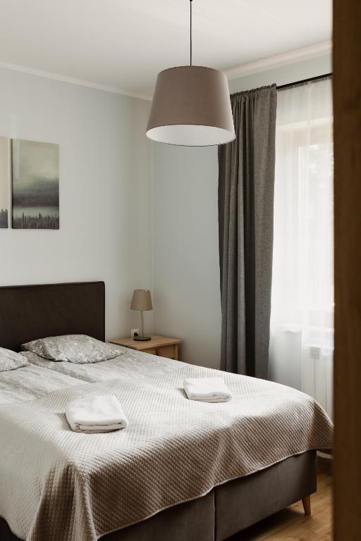 Posteľ alebo postele v izbe v ubytovaní Pająkówka Apartament I