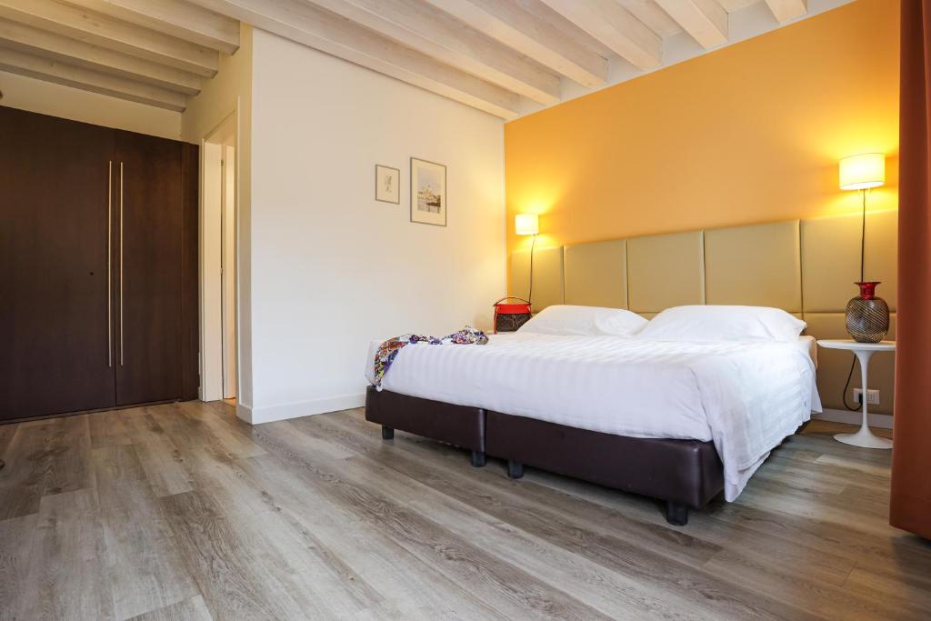 Postel nebo postele na pokoji v ubytování Relais Santa Corona