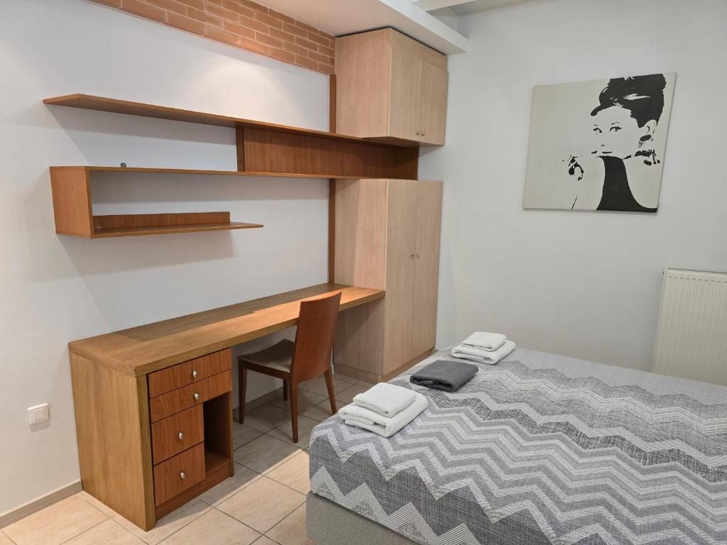 A bed or beds in a room at Xtina Studio