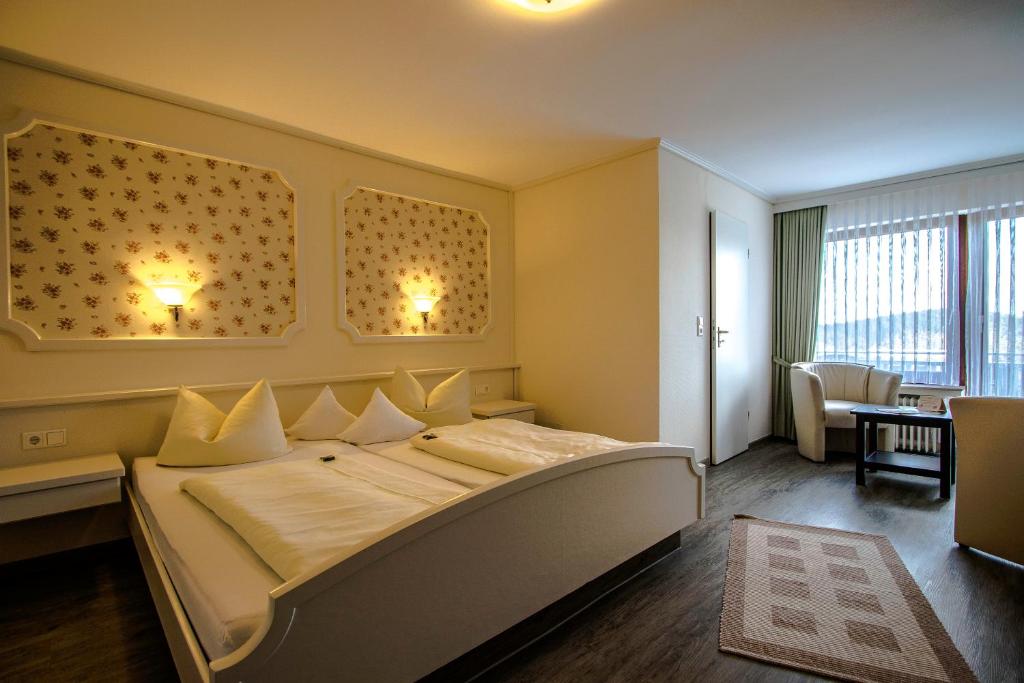 Postel nebo postele na pokoji v ubytování Hotel Schneider