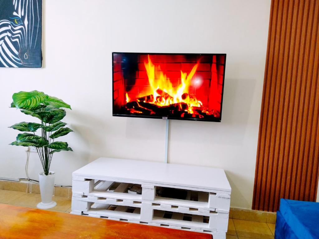 TV a/nebo společenská místnost v ubytování Cozy Haven