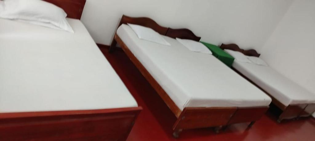 Postel nebo postele na pokoji v ubytování Hotel Lakeside