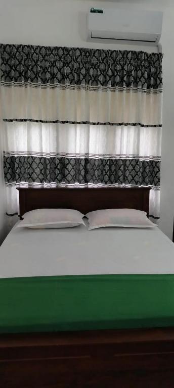 Postel nebo postele na pokoji v ubytování Hotel Lakeside