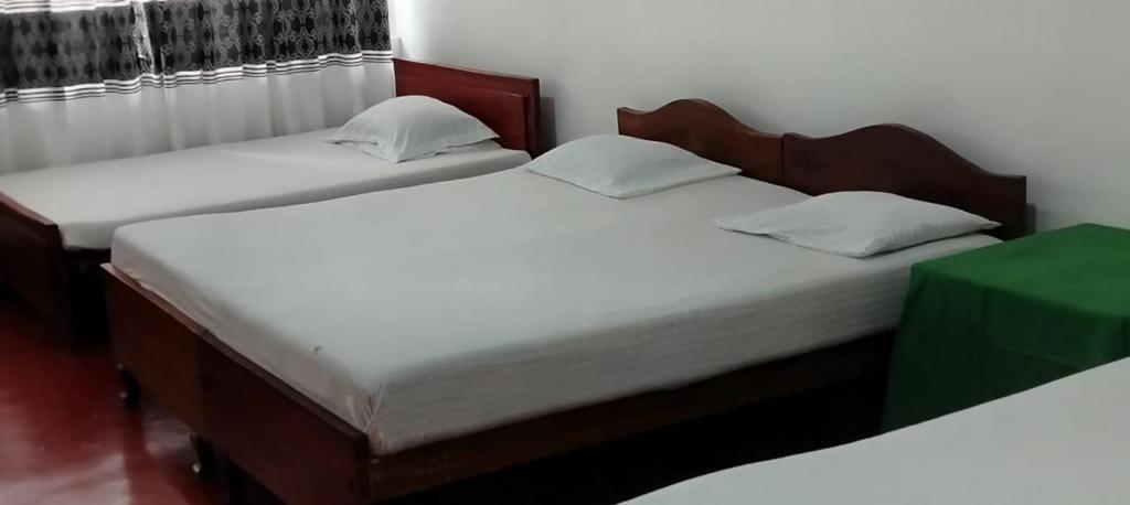 Postel nebo postele na pokoji v ubytování Hotel Lakeside