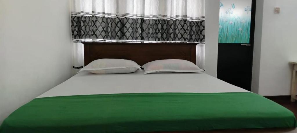 Postel nebo postele na pokoji v ubytování Hotel Lakeside