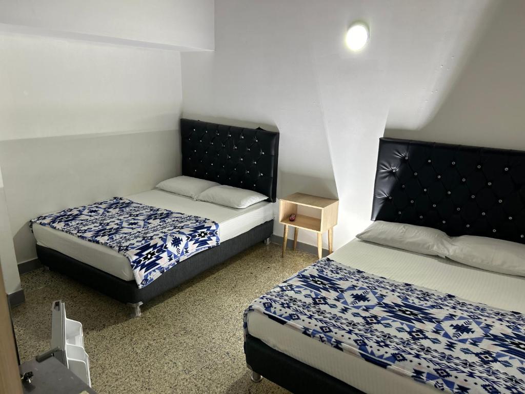 Postel nebo postele na pokoji v ubytování Hotel Urbano 70