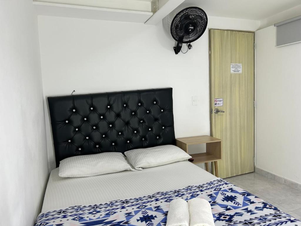 Postel nebo postele na pokoji v ubytování Hotel Urbano 70