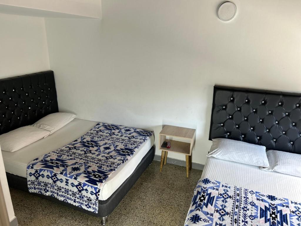 Postel nebo postele na pokoji v ubytování Hotel Urbano 70