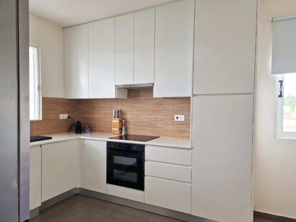 Kuchyň nebo kuchyňský kout v ubytování STAY Space View Apartment