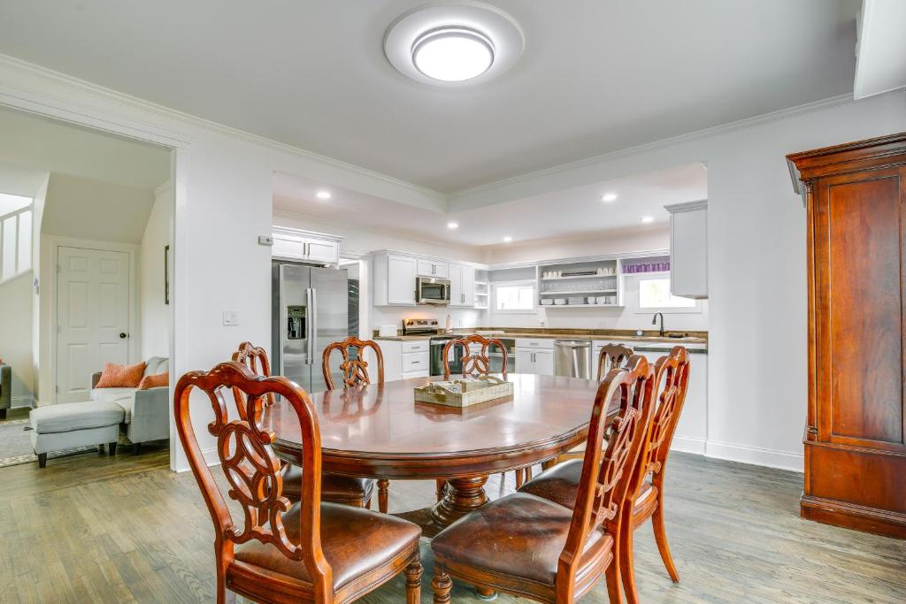 a kitchen and dining room with a table and chairs at Walk to Winery Family-Friendly Holt Getaway in Kearney