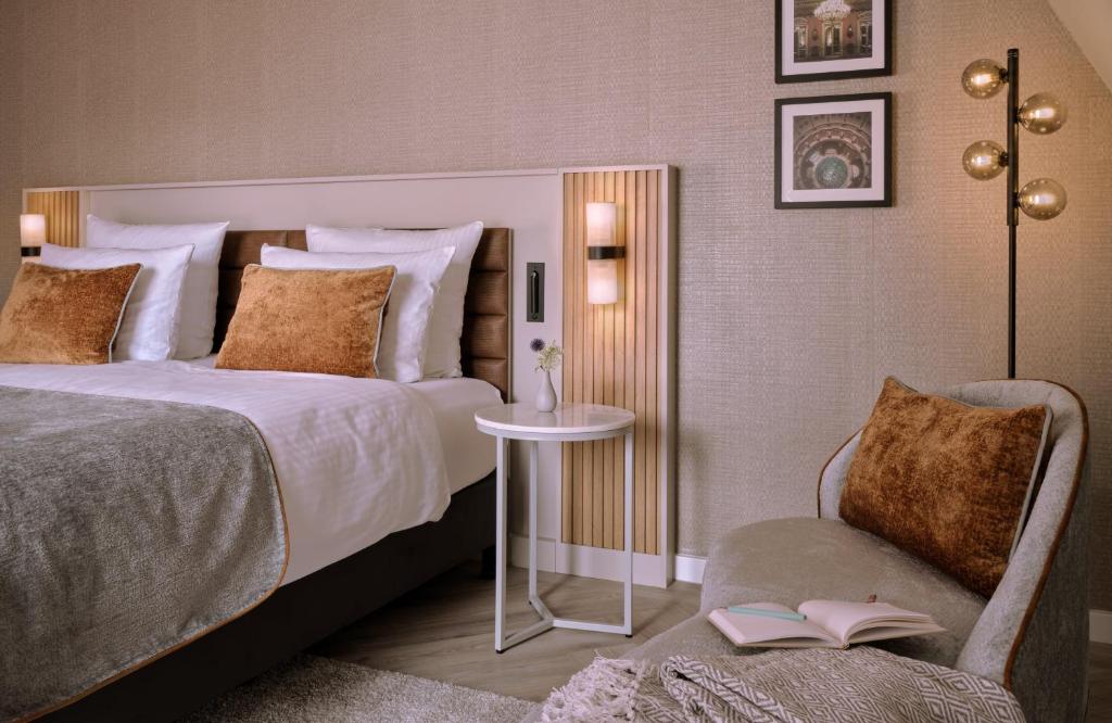 Postel nebo postele na pokoji v ubytování Leonardo Royal Hotel Baden- Baden