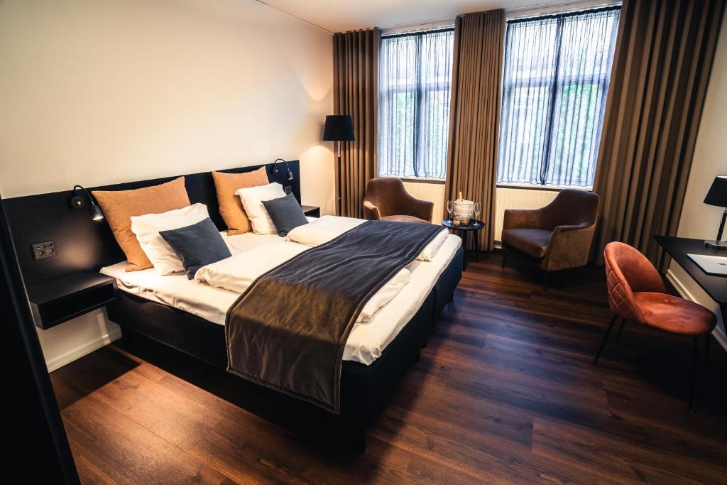 Letto o letti in una camera di Struer Grand Hotel