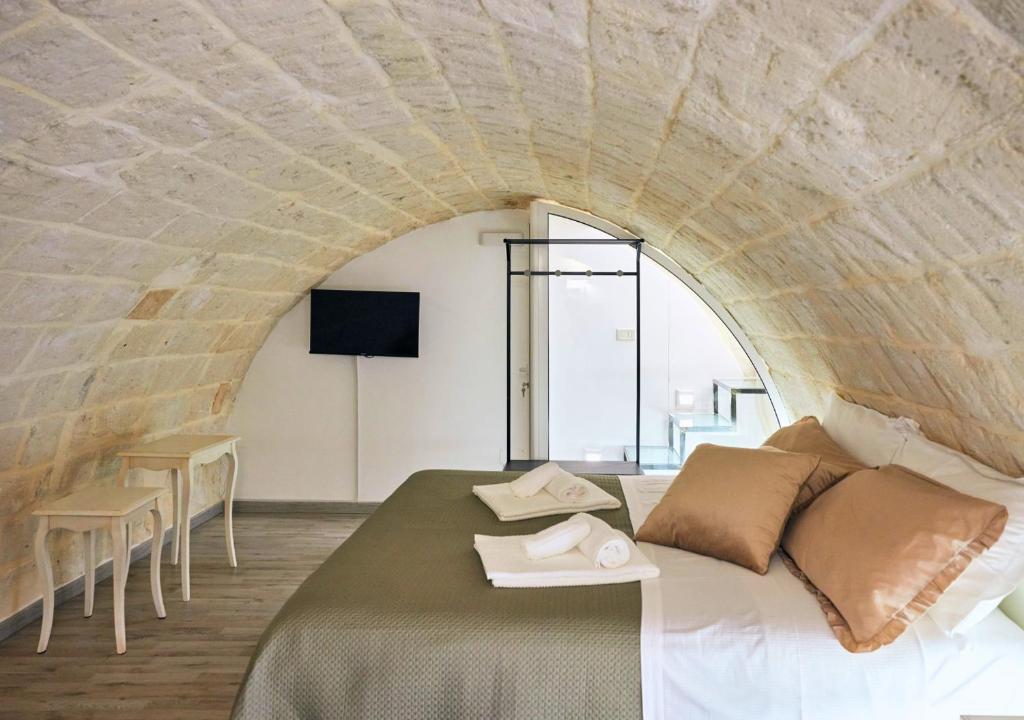 Postel nebo postele na pokoji v ubytování Casa Riscatto Suite
