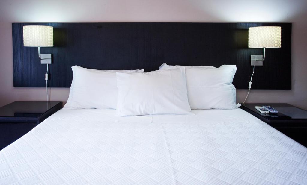 Ένα ή περισσότερα κρεβάτια σε δωμάτιο στο Residencial Principe Guest House