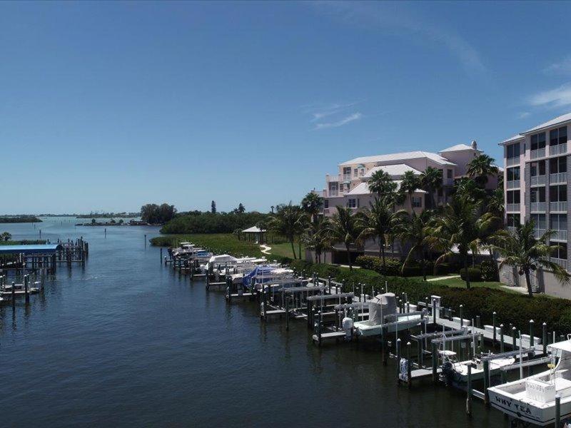 a marina with tables and chairs in the water at Boca Vista - Unit B202 in Englewood