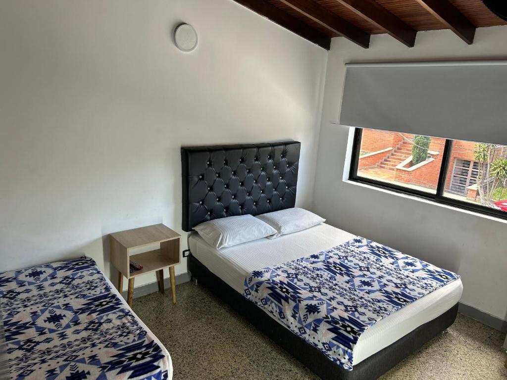 Postel nebo postele na pokoji v ubytování Hotel Urbano 70
