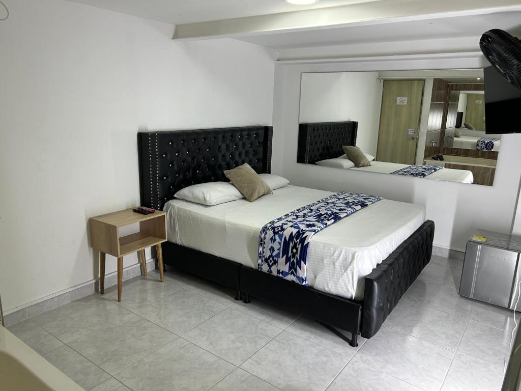 Postel nebo postele na pokoji v ubytování Hotel Urbano 70