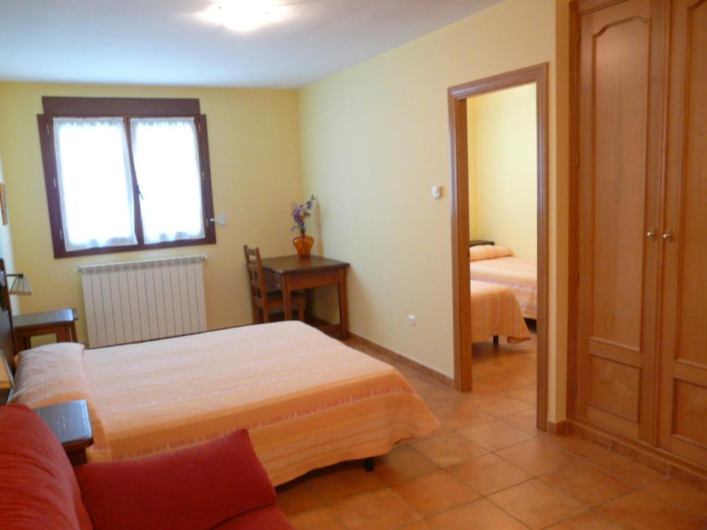 Postel nebo postele na pokoji v ubytování Complejo Turístico Bielsa Hotel y camping