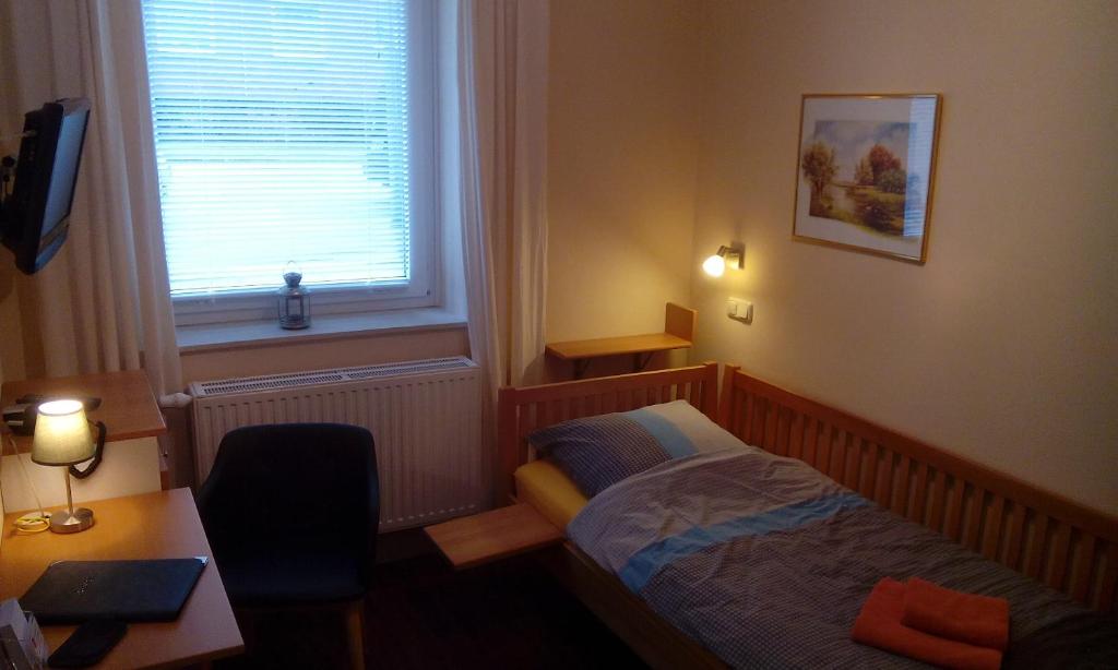 Postel nebo postele na pokoji v ubytování DARZ GästeZimmer
