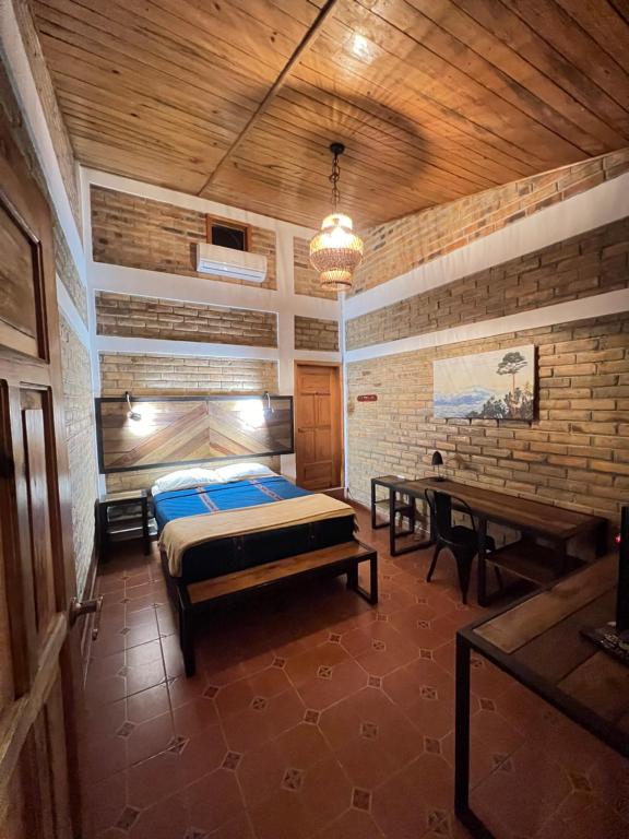 Postel nebo postele na pokoji v ubytování Jardín Café Hotel & Restaurant