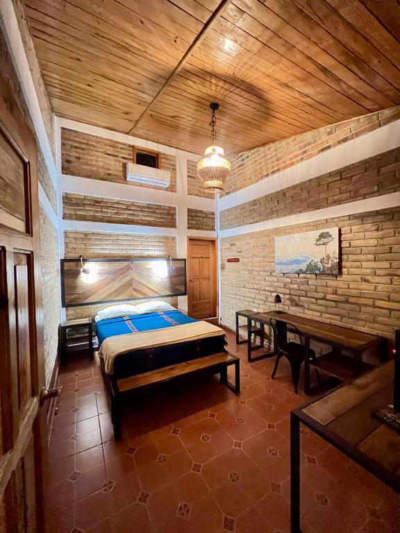 Postel nebo postele na pokoji v ubytování Jardín Café Hotel & Restaurant