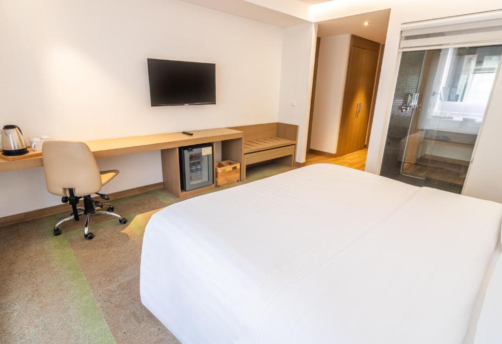 TV a/nebo společenská místnost v ubytování Biohotel Organic Suites