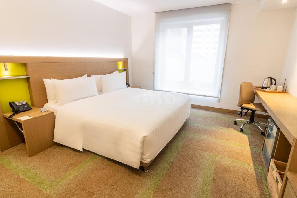 Postel nebo postele na pokoji v ubytování Biohotel Organic Suites