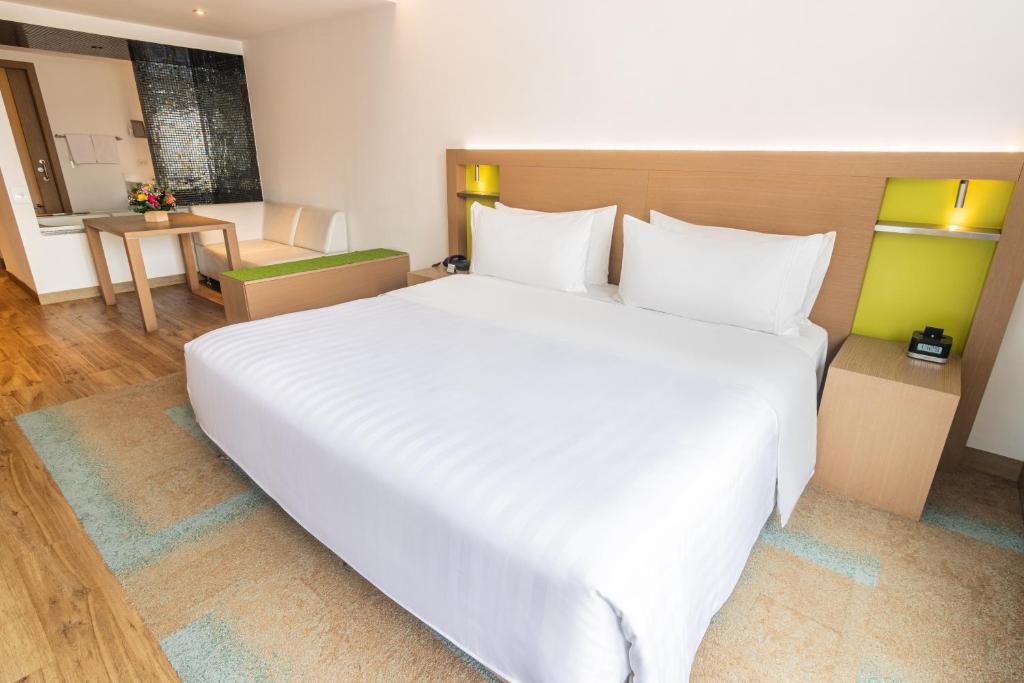 Postel nebo postele na pokoji v ubytování Biohotel Organic Suites