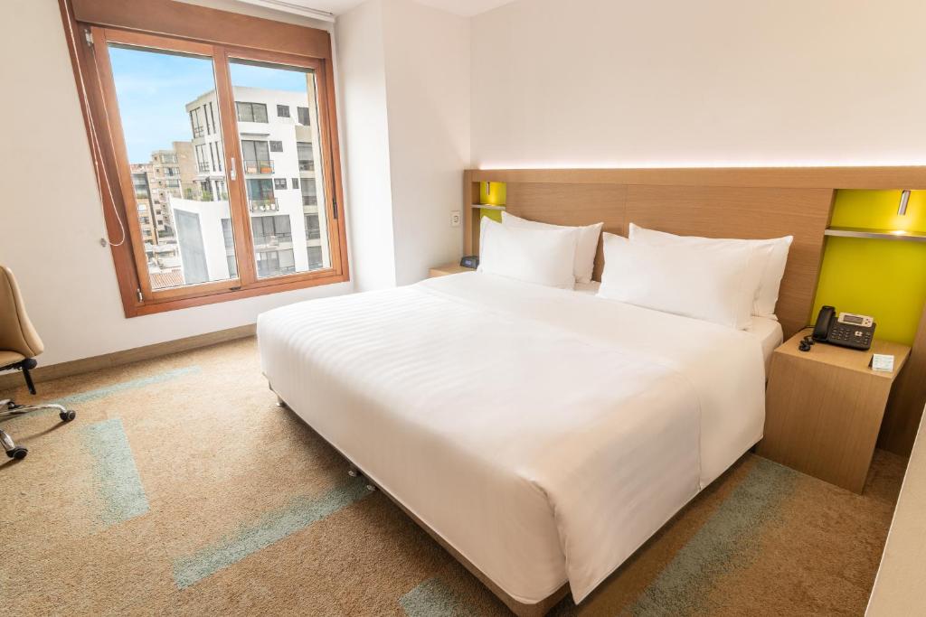 Postel nebo postele na pokoji v ubytování Biohotel Organic Suites