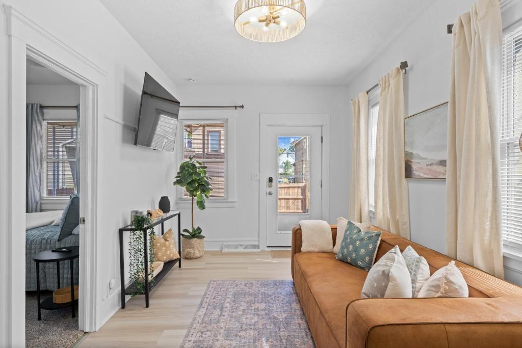 a living room with a couch and a table at Comfortable 2-Bedroom House In Cleveland 1330 in Cleveland