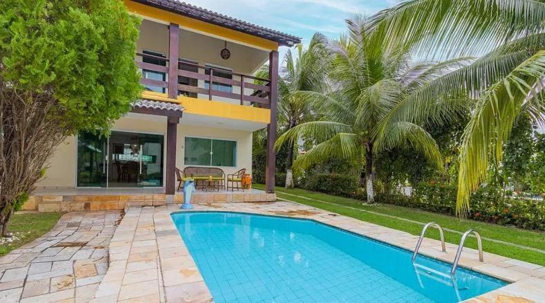 Πισίνα στο ή κοντά στο Casa espaçosa no Prive Baia do Cupe