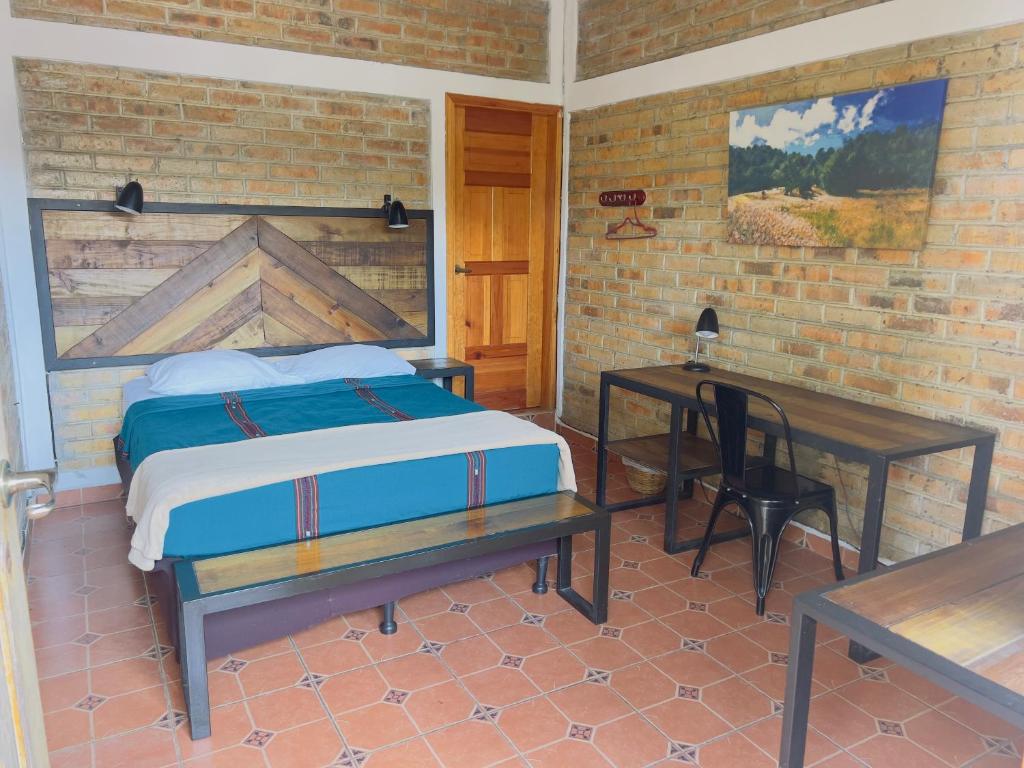Postel nebo postele na pokoji v ubytování Jardín Café Hotel & Restaurant