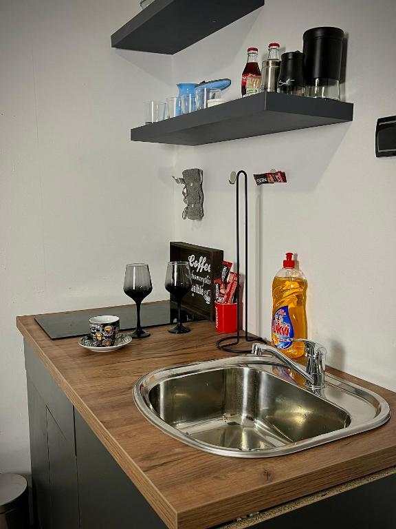 Kuchyň nebo kuchyňský kout v ubytování Apartment Code